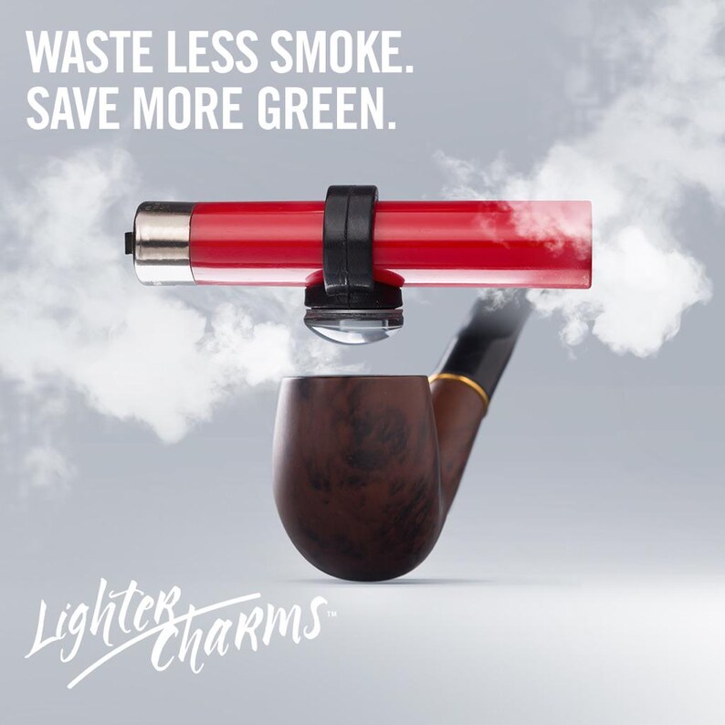 May include: A red lighter with a black clamp attached to a pipe. The lighter is hovering above the pipe, with smoke coming from the pipe. The text "WASTE LESS SMOKE. SAVE MORE GREEN." is at the top of the image. The text "Lighter Charms" is at the bottom of the image.
