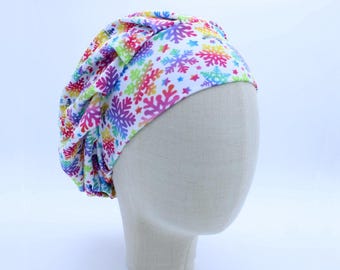 Neon Snowflakes on White Double Brushed Poly in a Bouffant Style Scrub Cap