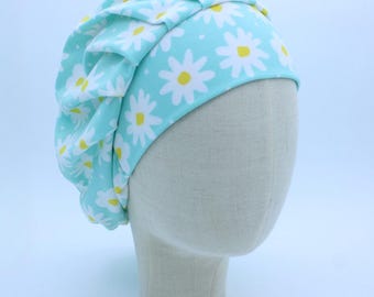 White Daisies on Bright Blue Background on Soft Jersey Fabric in a Bouffant Style Scrub Cap