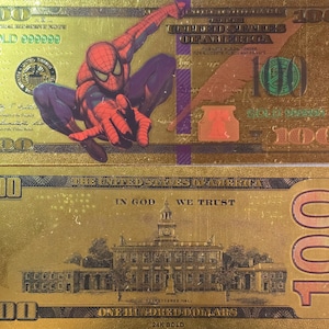 May include: A gold-coloured £100 note with a picture of Independence Hall on the front and a picture of Spiderman on the back. The note says "GOLD 999999" and "24K GOLD" on it.