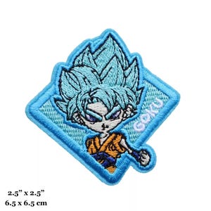 May include: Blue and orange embroidered iron-on patch featuring a cartoon character with blue hair and the word "Goku" in white text.