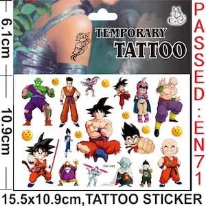 May include: A sheet of temporary tattoos featuring characters from the Dragon Ball Z anime series. The sheet includes Goku, Vegeta, Piccolo, and other characters. The sheet is 15.5 inches by 10.9 inches and includes the text "Temporary Tattoo" and "Passed: EN71".