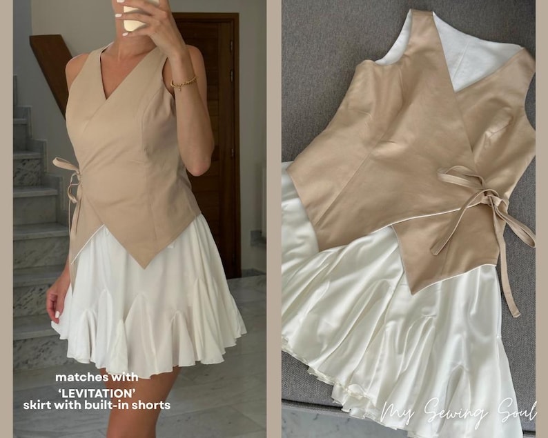 May include: A beige wrap top with a V-neck and tie closure, paired with a white skirt featuring built-in shorts. The skirt has a ruffled hem. The outfit is a modern take on a classic style.