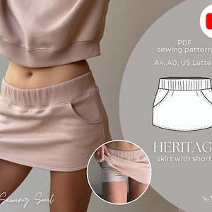 Op de afbeelding: Een lichtroze rok met shorts, met een brede tailleband en zakken. De afbeelding bevat een diagram van de rok en de tekst "HERITAGE rok met shorts" en "S-XXXL". De tekst "My Sewing Soul" is ook zichtbaar.