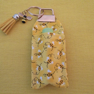 Lip Balm Holder with Key Ring, Tassel, Bee Charm and Burt&#39;s Bee&#39;s Lip Balm.