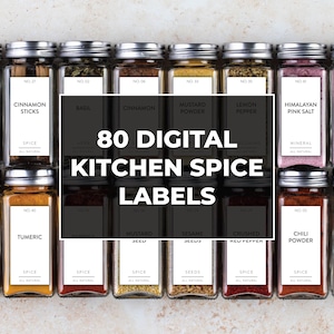 May include: An assortment of glass spice jars with silver lids, each labeled with spice names like Dill, Cinnamon Sticks, and Chili Powder. The image features the text "80 DIGITAL KITCHEN SPICE LABELS" in a white rectangle.