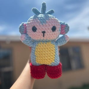 Monkey wearing red boots crocheted plushie