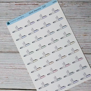 May include: A sheet of planner stickers featuring illustrations of fountain pens in various pastel colors. Each pen has the word "edit" next to it. The stickers are labeled "Novel Planning - Edit" and "snowdrop + sassafras".