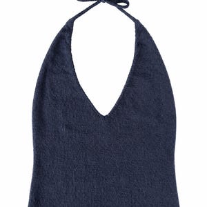 May include: A dark navy blue knit halter top featuring a deep V-neckline and thin straps that tie at the top. The garment is constructed from a fine-gauge knit fabric with a simple, clean hemline at the bottom, presenting a solid colour throughout.