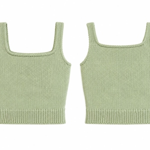 May include: Two sage green knitted tank tops with square necklines and wide straps. The tops have a ribbed hem and a close knit texture. The tank tops are displayed on a white background.