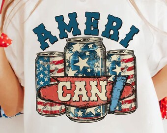 May include: White t-shirt featuring a patriotic design with the text "AMERI CAN". The graphic includes three beverage cans with American flag and star patterns. The design is in red, white, and blue.