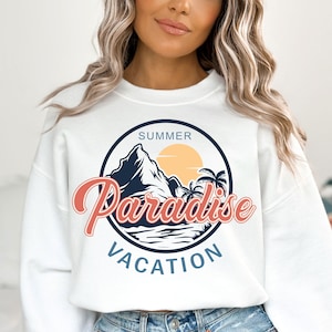 May include: White sweatshirt with a graphic print of a mountain, palm trees, and a sun. The graphic is in a circle with the text "SUMMER PARADISE VACATION".