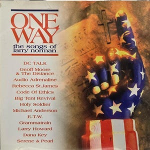 May include: A CD case featuring the album "ONE WAY: the songs of Larry Norman." The cover art displays a hand with the American flag design, a cross, and the names of the artists. The CD case is in a clear plastic jewel case.