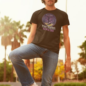 May include: A black t-shirt with a purple and blue graphic of a person skateboarding. The graphic is in a circle with the text "Arcade Feeling" at the top and "The Nights Never End" at the bottom.