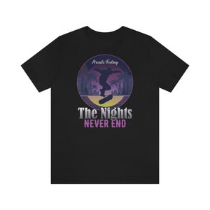 May include: Black t-shirt with a retro-style graphic of a skateboarder in a sunset scene. The text "Arcade Feeling" and "The Nights Never End" is printed on the shirt.