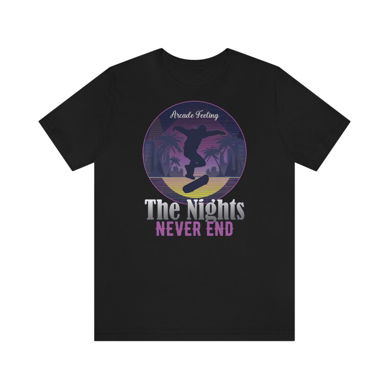 May include: Black t-shirt with a retro-style graphic of a skateboarder in a sunset scene. The text "Arcade Feeling" and "The Nights Never End" is printed on the shirt.