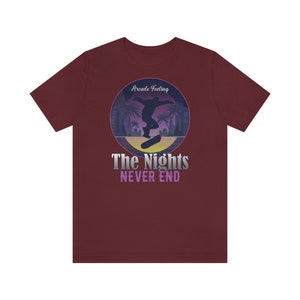 May include: A maroon t-shirt with a retro-style graphic of a skateboarder in silhouette, palm trees, and the text "Arcade Feeling The Nights NEVER END".