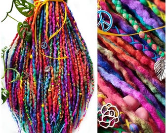 May include: A vibrant set of colorful dreadlocks in shades of red, orange, yellow, green, blue, and purple. The dreads are adorned with decorative charms, including peace signs and floral designs, and tied with a yellow ribbon. The style is bohemian and artistic.