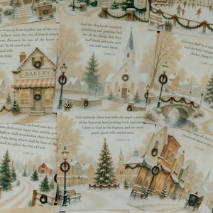 May include: A collection of square cards featuring watercolor-style winter village scenes decorated for Christmas, each paired with printed Bible verses in black serif font. The illustrations depict snow-covered buildings, trees, and street lamps.