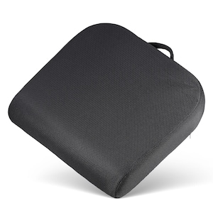 May include: Black mesh seat cushion with a zipper and a handle. The cushion is designed to provide comfort and support while sitting.