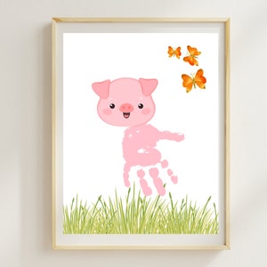 May include: A pink pig handprint with a smiling face and a white background. There are three orange butterflies in the top right corner of the image.