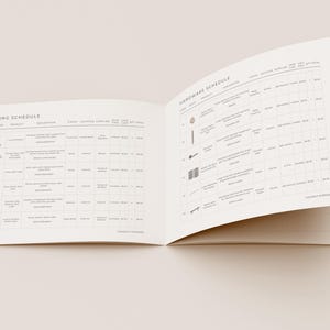 May include: An open booklet displaying a Lighting Schedule and a Hardware Schedule on white pages with black text and small illustrations. The tables contain columns for item, product, description, finish, supplier, and quantity, organized in a grid.