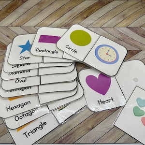 May include: A set of colorful flashcards featuring various shapes, including a star, rectangle, circle, heart, and clock. The flashcards are labeled with the name of each shape.