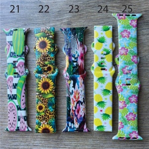 May include: Five different Apple Watch bands with various colorful and patterned designs. The bands are numbered 21 through 25.