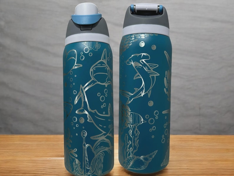 May include: A set of three ceramic mugs with a speckled, matte finish. The mugs are in shades of cream, light gray, and dark gray. Each mug has a simple, minimalist design, perfect for coffee or tea.