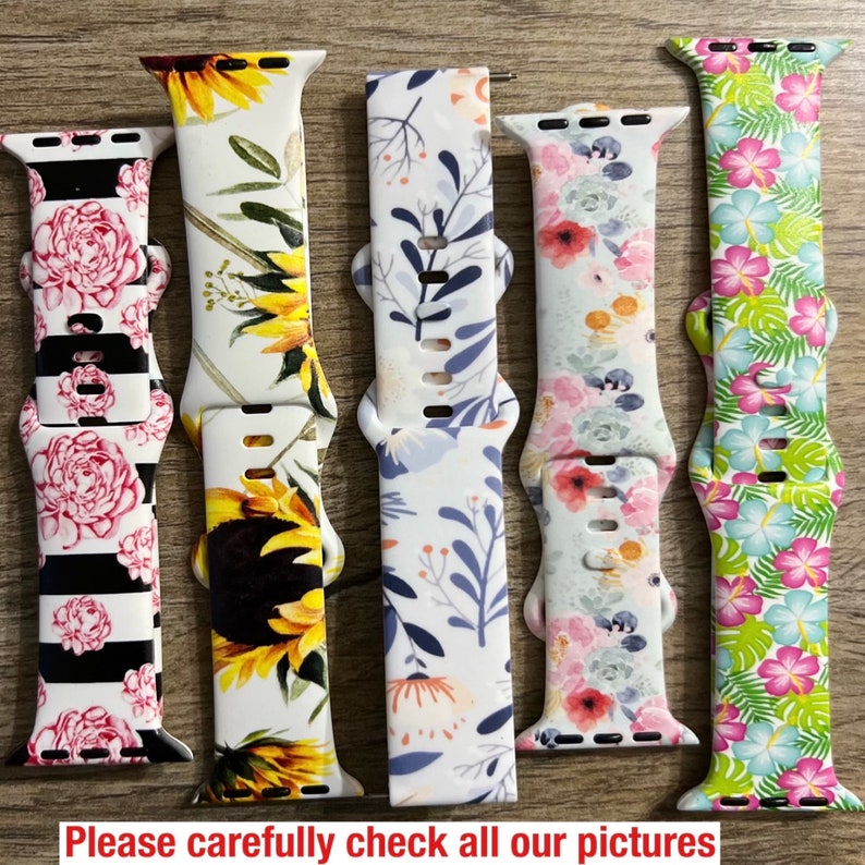 May include: Five different patterned watch bands. The bands are made of silicone and have a variety of floral and geometric designs. The bands are all in bright colors, including pink, yellow, green, blue, and white.
