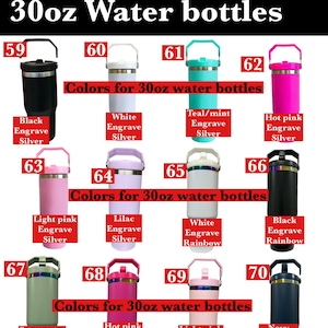 May include: A variety of 30oz water bottles in various colors, including black, white, teal, hot pink, light pink, lilac, sage green, and navy. Each bottle has a handle and is labeled with its color and engraving details.