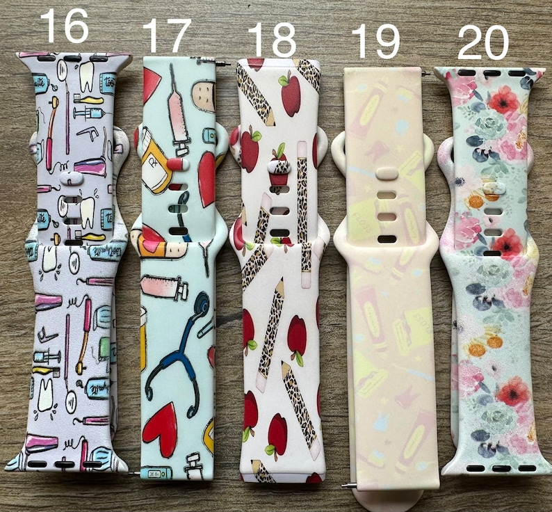 May include: Ten different Apple Watch bands with various designs. The bands are numbered 16 through 20. The designs include dental tools, medical tools, pencils, apples, and floral patterns.