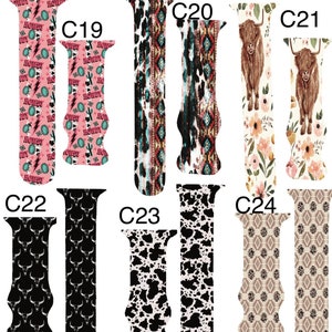 May include: A selection of watch straps featuring diverse patterns. Designs include a pink "Howdy" print, tribal motifs, cowhide, floral arrangements with a Highland cow, a black bull skull design, and geometric patterns. Each strap showcases a unique design.