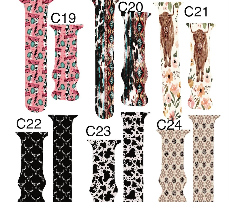 May include: A selection of watch straps featuring diverse patterns. Designs include a pink "Howdy" print, tribal motifs, cowhide, floral arrangements with a Highland cow, a black bull skull design, and geometric patterns. Each strap showcases a unique design.