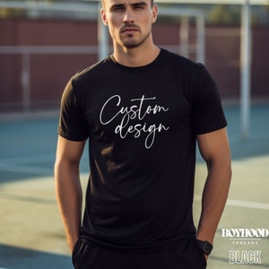 May include: Black t-shirt with the text "Custom design" in white lettering. The t-shirt is made by Boyhood Threads.
