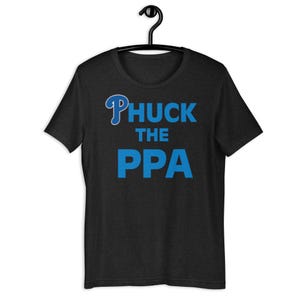 May include: A black t-shirt with a blue "Phuck the PPA" graphic. The graphic features a stylised "P" with a baseball bat.