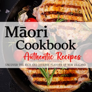 May include: A cookbook cover featuring a close-up of grilled pork chops in a cast iron skillet with rosemary sprigs, tomatoes, and garlic. The title "Māori Cookbook Authentic Recipes" is displayed in bold black text with the subtitle "Uncover the rich and diverse flavours of New Zealand" in smaller black text. The author's name "AMARA E. ΚΑΙΗΕ" is displayed in the bottom left corner.