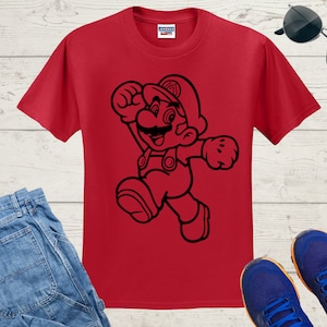 K&ouml;nnte beinhalten: Rotes T-Shirt mit einer schwarzen Umrandung von Mario aus der Super Mario Bros. Videospielserie.