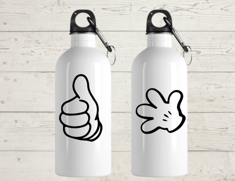 May include: Two white water bottles with black accents. One bottle features a black thumbs-up graphic, and the other has a black cartoon hand graphic. Each bottle has a black carabiner clip attached to the top.