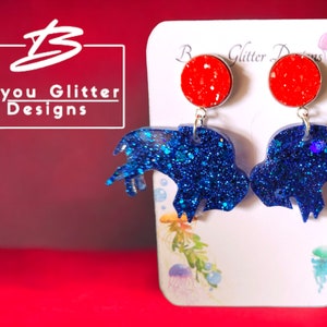 Show Your Team Colors with these Great Buffalo Bills Earrings!  Beautiful Blue Buffalo&#39;s with a Red Cabachon&#39;s..they are Sure to be a Hit!