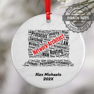 May include: White round ceramic ornament with a black and white word cloud depicting network architecture terms. The words "Network Architect" are highlighted in red. The ornament is personalized with the name "Alex Michaels" and the year "202X".