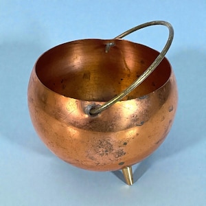 May include: A set of three ceramic mugs with a speckled, matte finish. The mugs are in shades of cream, light gray, and dark gray. Each mug has a simple, minimalist design, perfect for coffee or tea.