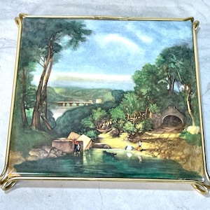 May include: A set of three ceramic mugs with a speckled, matte finish. The mugs are in shades of cream, gray, and black. Each mug has a simple, modern design, perfect for coffee or tea. The mugs are stacked on top of each other.