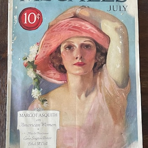 May include: Vintage McCall's magazine cover from July featuring a woman in a pink hat and dress. The cover includes the text "McCall's" and "10¢". The cover also features the text "Margot Asquith on American Women".