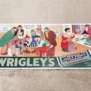 May include: Vintage Wrigley's Juicy Fruit chewing gum advertisement. The colorful illustration depicts a group of people in a store, with text that reads "Juicy Fruit" and "You'll like it!" The sign is rectangular and has a white border.