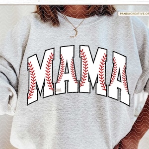 May include: A gray sweatshirt with the word "MAMA" in white letters with red baseball stitching.
