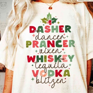 May include: Cream-colored t-shirt with the words "DASHER, dancer, PRANCER, vixen, WHISKEY, tequila, VODKA, blitzen" in red, green, and white. The design includes a holly sprig and star accents. The shirt is part of a digital download collection.