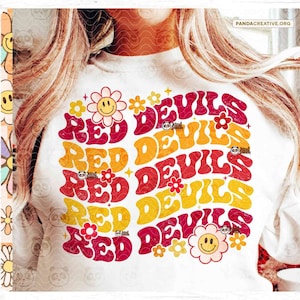 May include: Red Devils text in a retro 70s style font with a red, orange, and yellow color gradient. The text is surrounded by small yellow flowers with smiley faces.