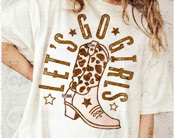 May include: A white t-shirt with a brown graphic design that says "Let's Go Girls" with a cowboy boot in the middle. The boot is brown with a white sole and has a leopard print design.