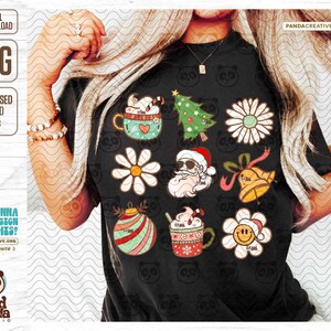 May include: Black t-shirt featuring a collection of Christmas-themed graphics. Designs include a Santa Claus, Christmas tree, daisy, ornament, bell, and coffee cup. The shirt also has the text "DIGITAL DOWNLOAD" and "PNG".
